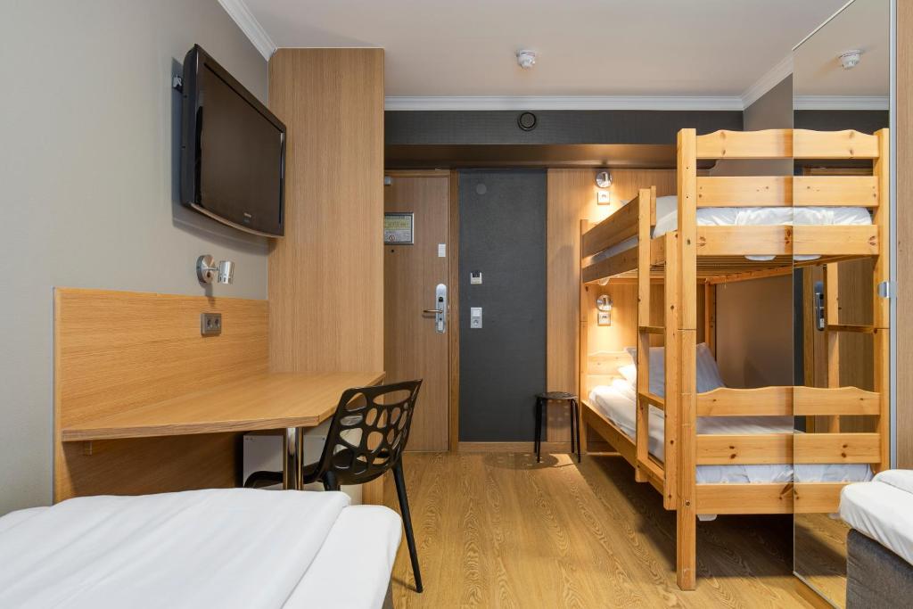 Postel nebo postele na pokoji v ubytování Göteborgs Mini-Hotel