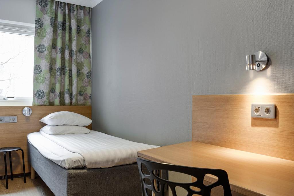 Postel nebo postele na pokoji v ubytování Göteborgs Mini-Hotel