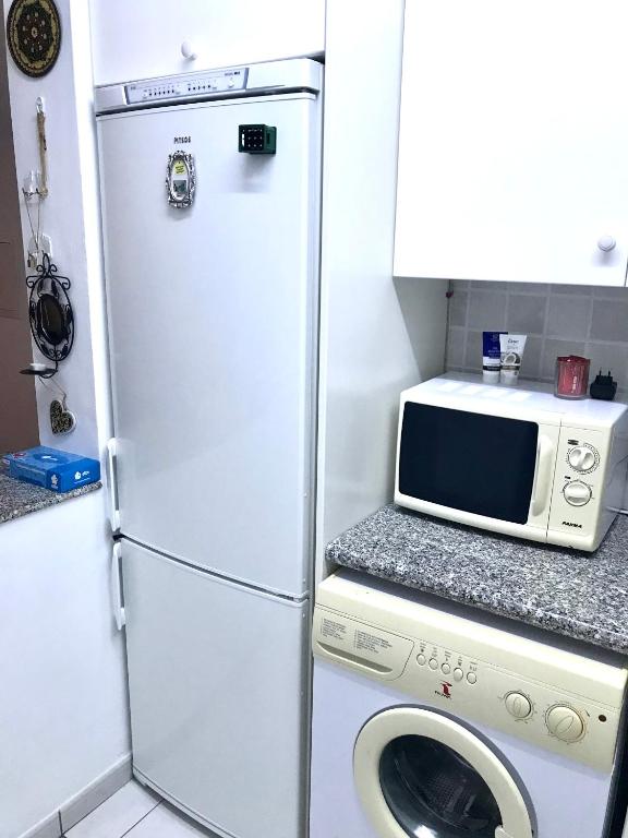 Kuchyň nebo kuchyňský kout v ubytování Owls Nest Townhouse