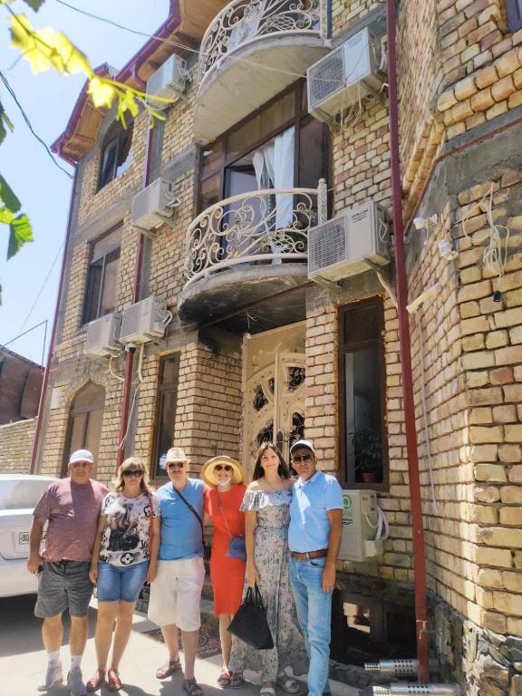 a group of people standing in front of a building at Samarkand Сity Guest House in Samarkand