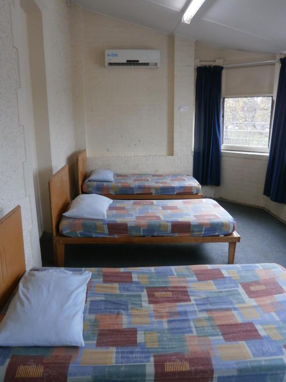 Postel nebo postele na pokoji v ubytování Launceston Backpackers