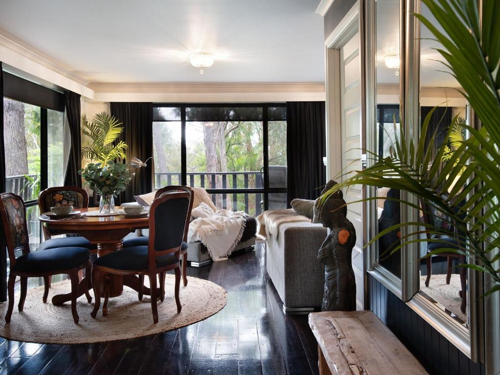 a living room with a couch and a table at Lardi Lane- romantic getaway in Daylesford