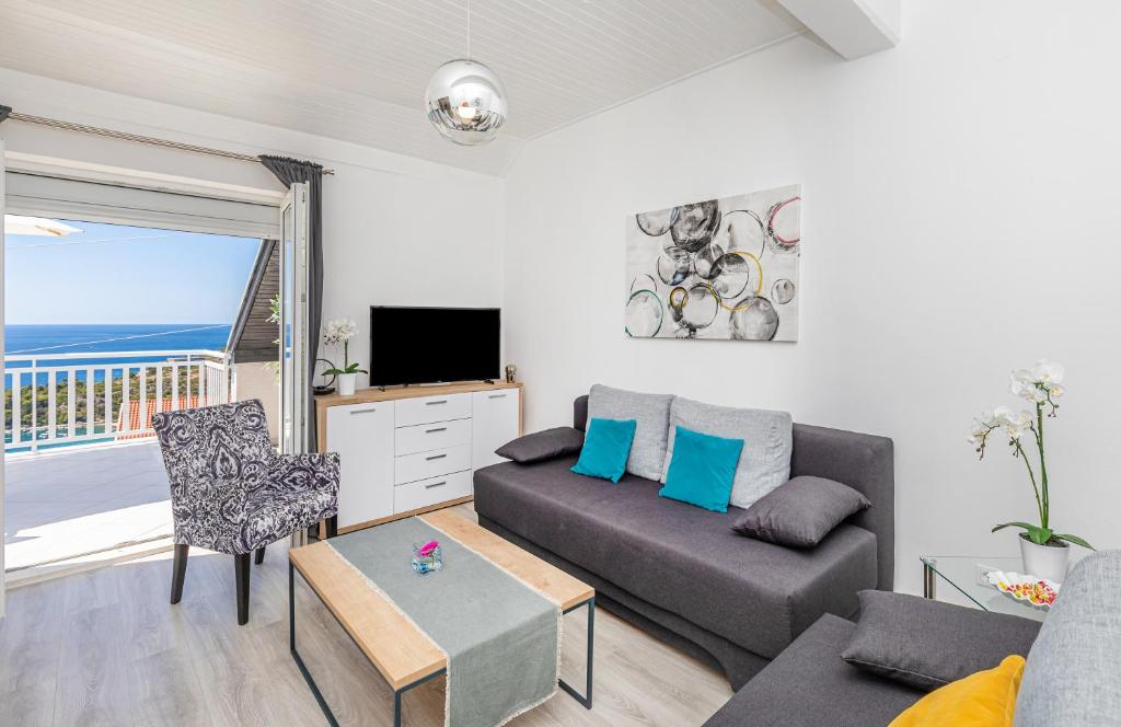 Televízia a/alebo spoločenská miestnosť v ubytovaní Apartment 24