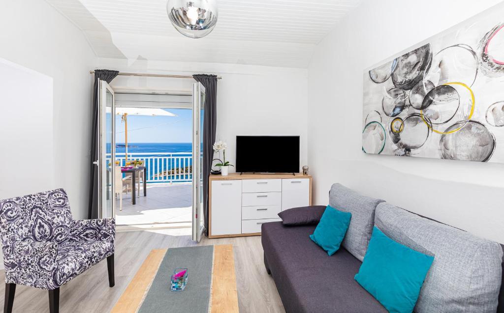 Televízia a/alebo spoločenská miestnosť v ubytovaní Apartment 24