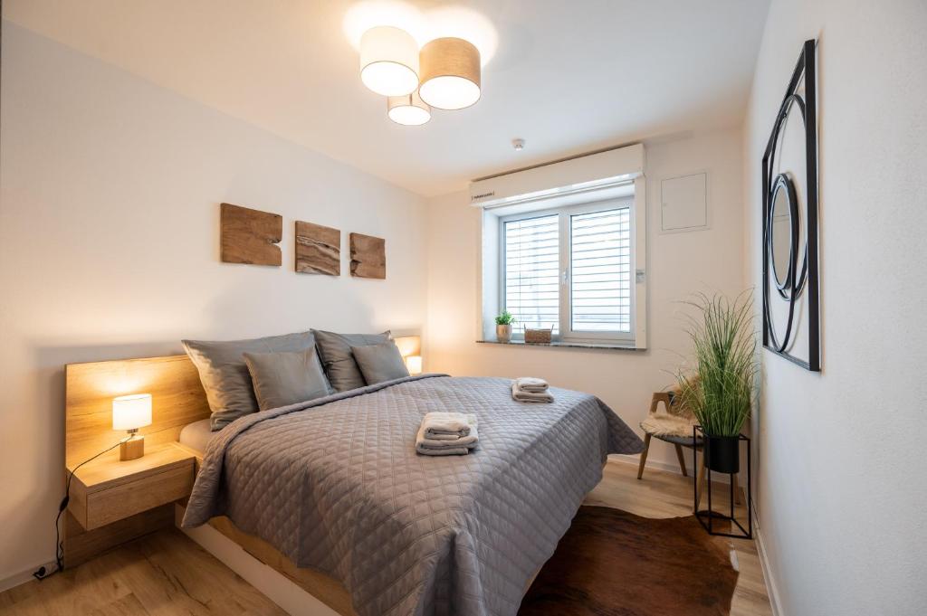 Łóżko lub łóżka w pokoju w obiekcie Apartmány Kaskády Luhačovice