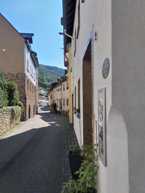 an empty street in a town with buildings at Haus Engelskrug in Senheim