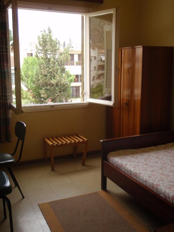 A bed or beds in a room at Artemis