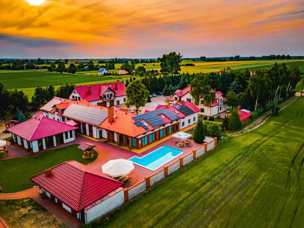 an overhead view of a house with red roofs at Ośrodek Agroturystyczny Zacisze in Giewartów