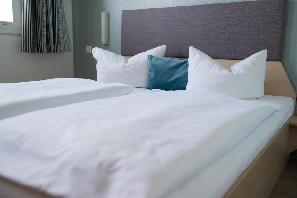 Postel nebo postele na pokoji v ubytování Rosen-Hotel