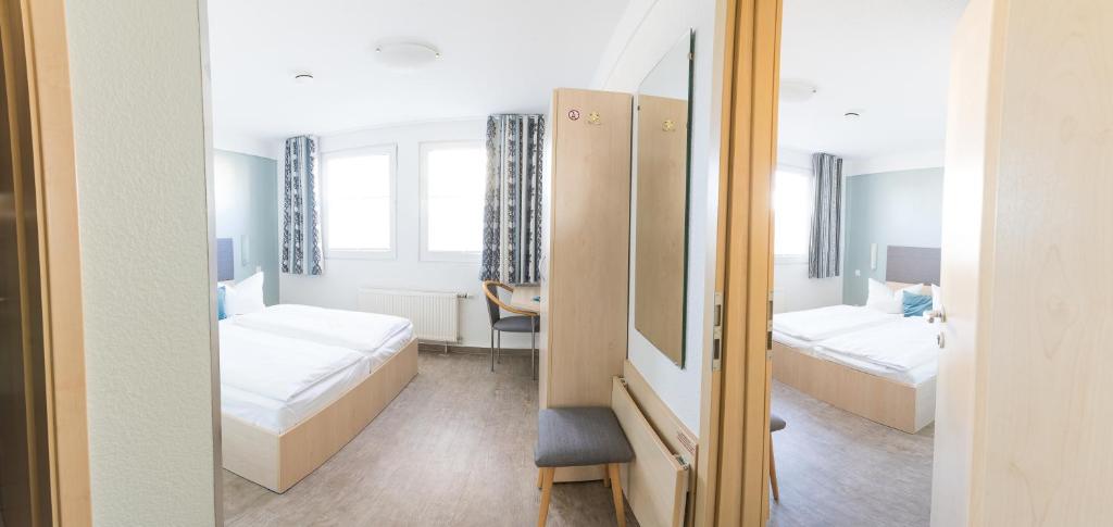 Postel nebo postele na pokoji v ubytování Rosen-Hotel