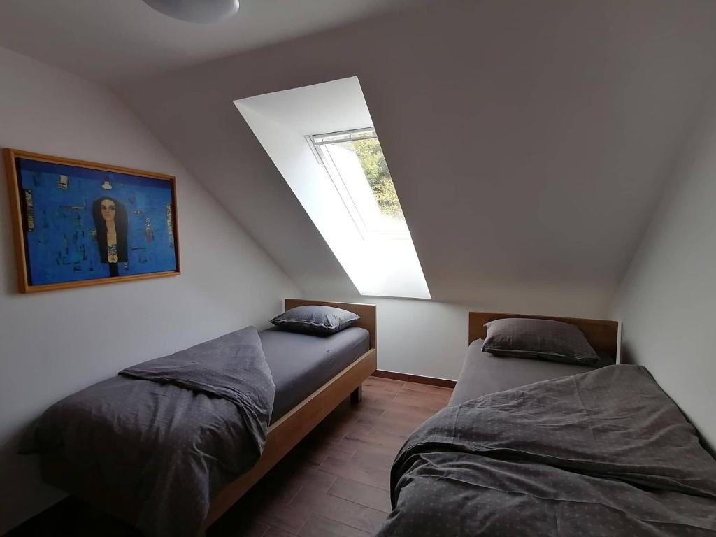 Säng eller sängar i ett rum på BLATNIKOV HRAM
