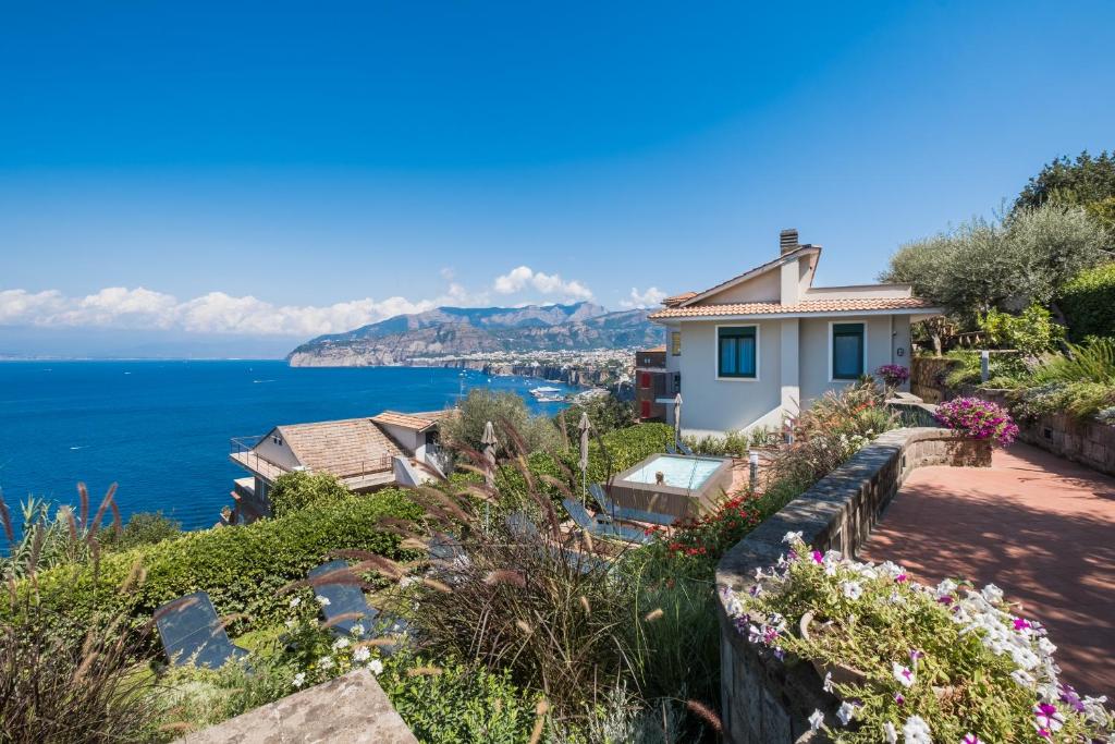 a house with a view of the ocean at Sorrento & Else - Deluxe Apartments in Sorrento