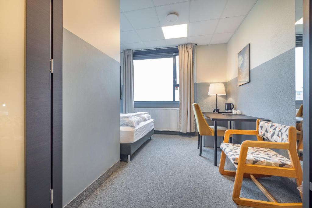 Rúm í herbergi á ABC Hotel by Reykjavik Keflavik Airport