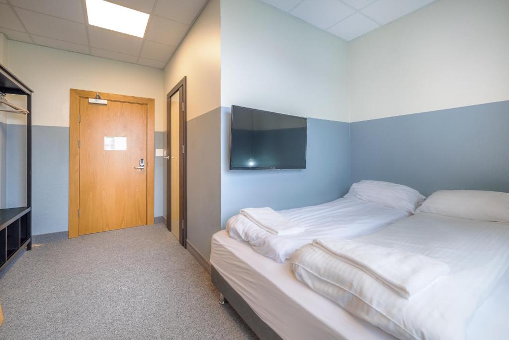 Rúm í herbergi á ABC Hotel by Reykjavik Keflavik Airport