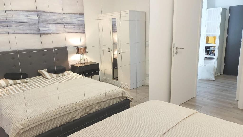 Posteľ alebo postele v izbe v ubytovaní Apartament Mare , Rewal ulica Szczecińska 21 Apartament nr 3