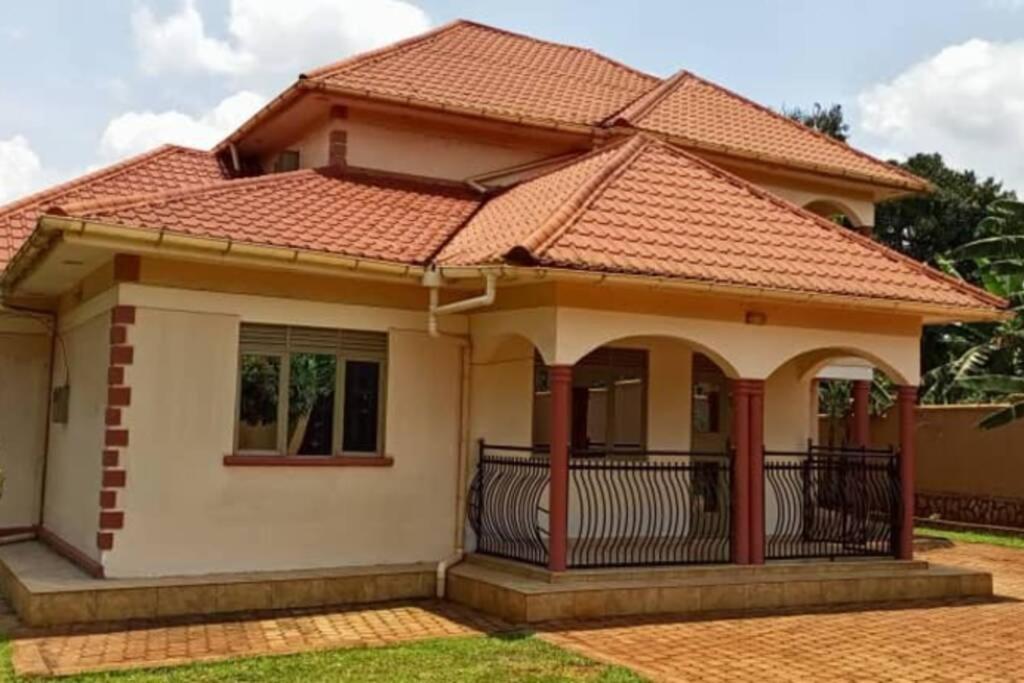 a house with an orange tile roof at Bujagali Villa in Jinja