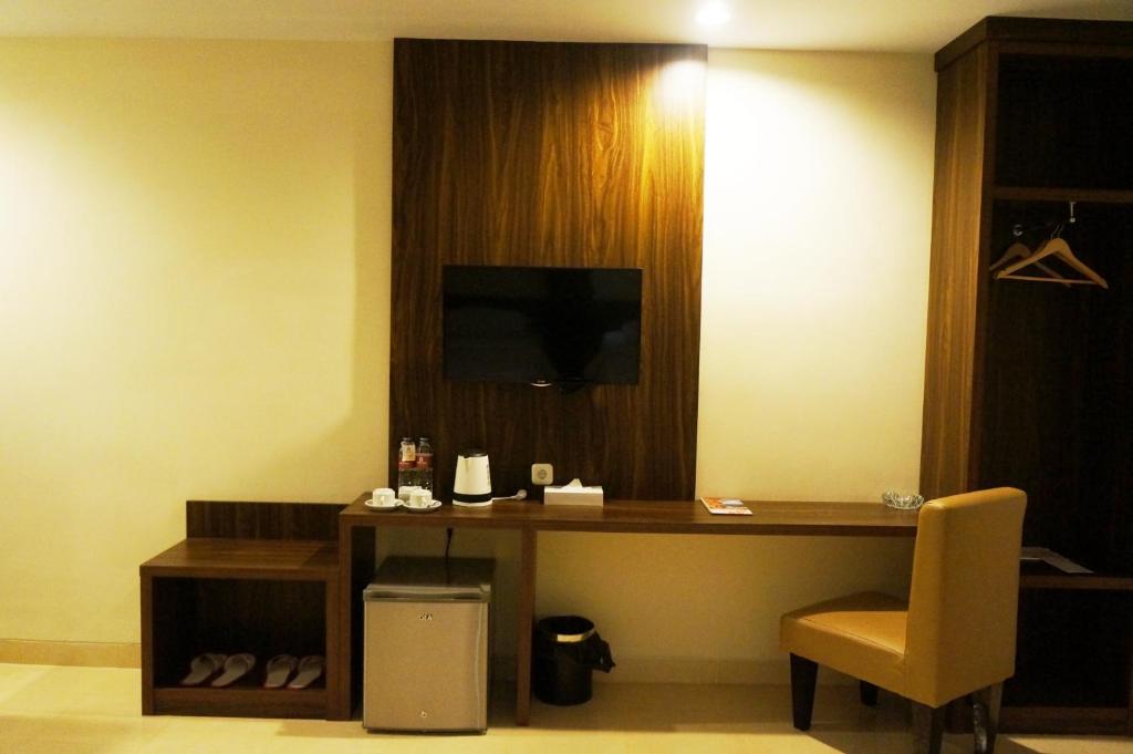 TV a/nebo společenská místnost v ubytování Ameera Hotel