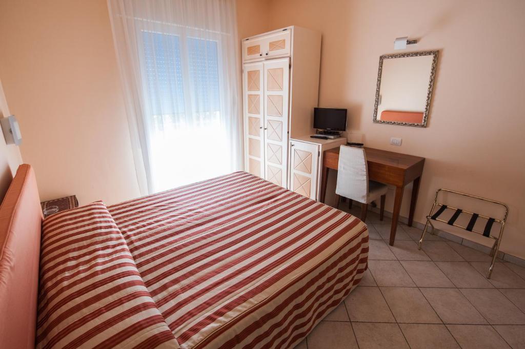 Postel nebo postele na pokoji v ubytování Alba Hotel