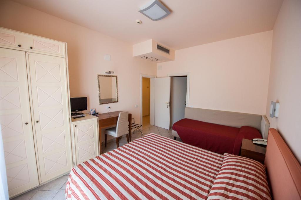 Postel nebo postele na pokoji v ubytování Alba Hotel