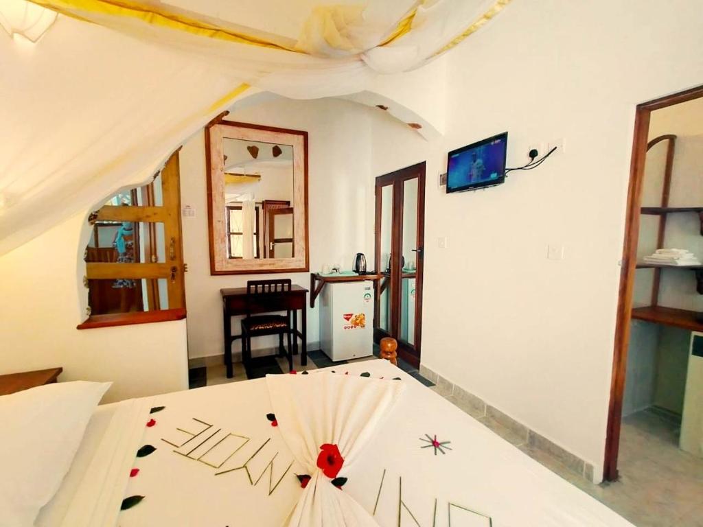 Postel nebo postele na pokoji v ubytování Watamu Solana Apartments