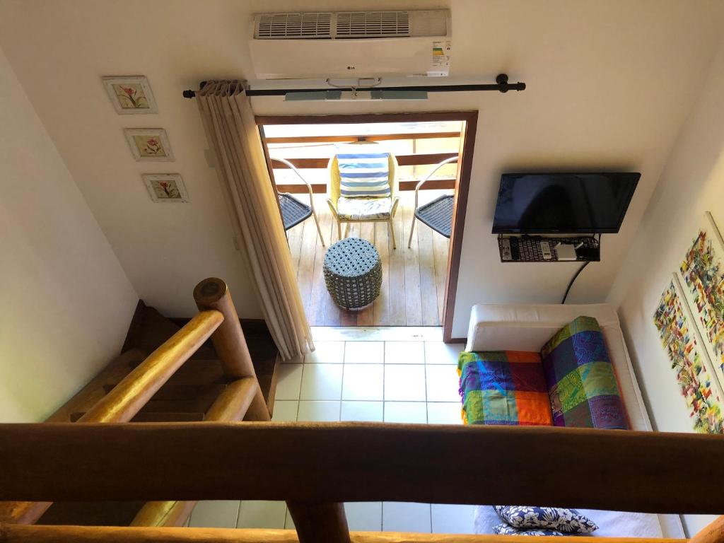 Posezení v ubytování Loft encantador em Praia do Forte próximo à Vila.