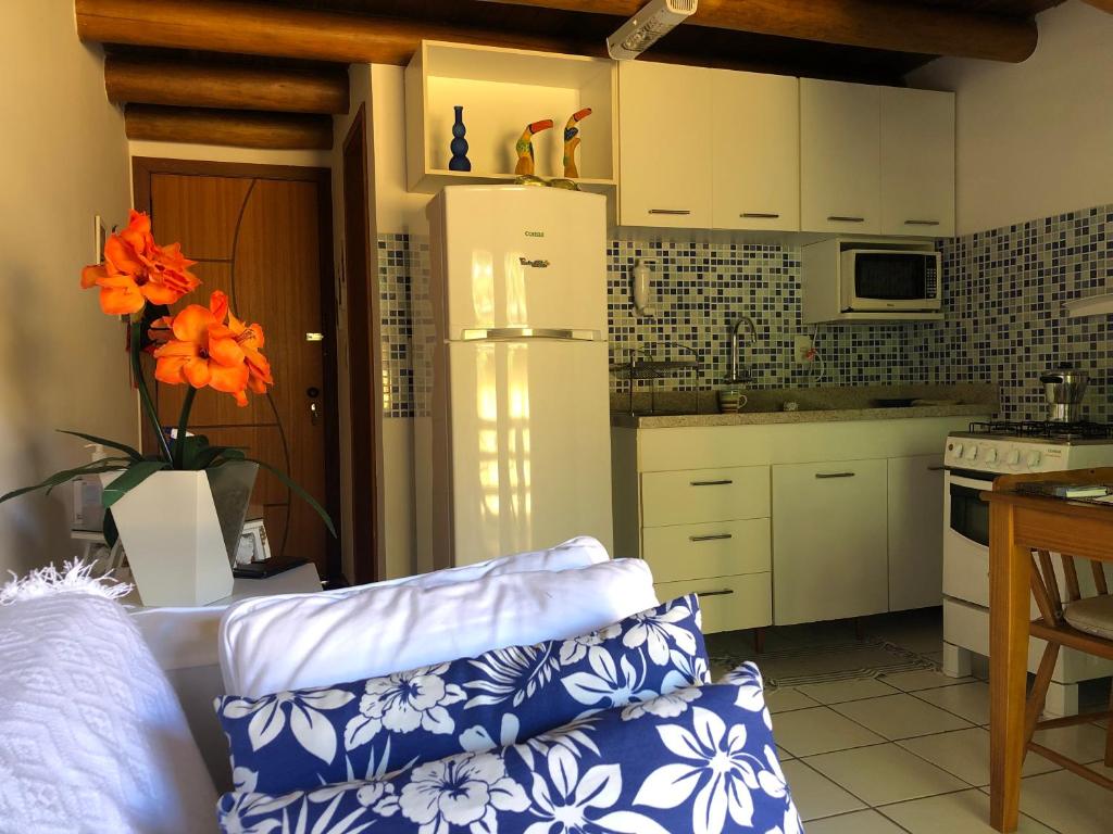Kuchyň nebo kuchyňský kout v ubytování Loft encantador em Praia do Forte próximo à Vila.