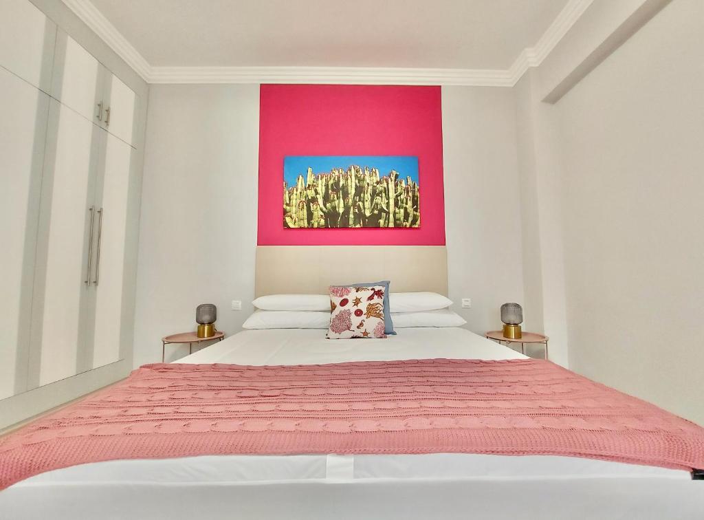 Posteľ alebo postele v izbe v ubytovaní Aromas Suites Apartments