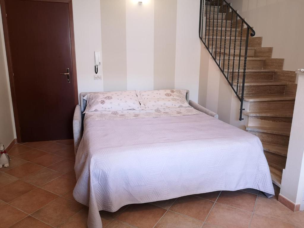 Łóżko lub łóżka w pokoju w obiekcie Villa Terrena