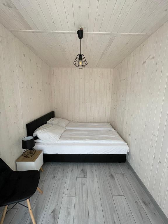 Postel nebo postele na pokoji v ubytování Domki Norda II