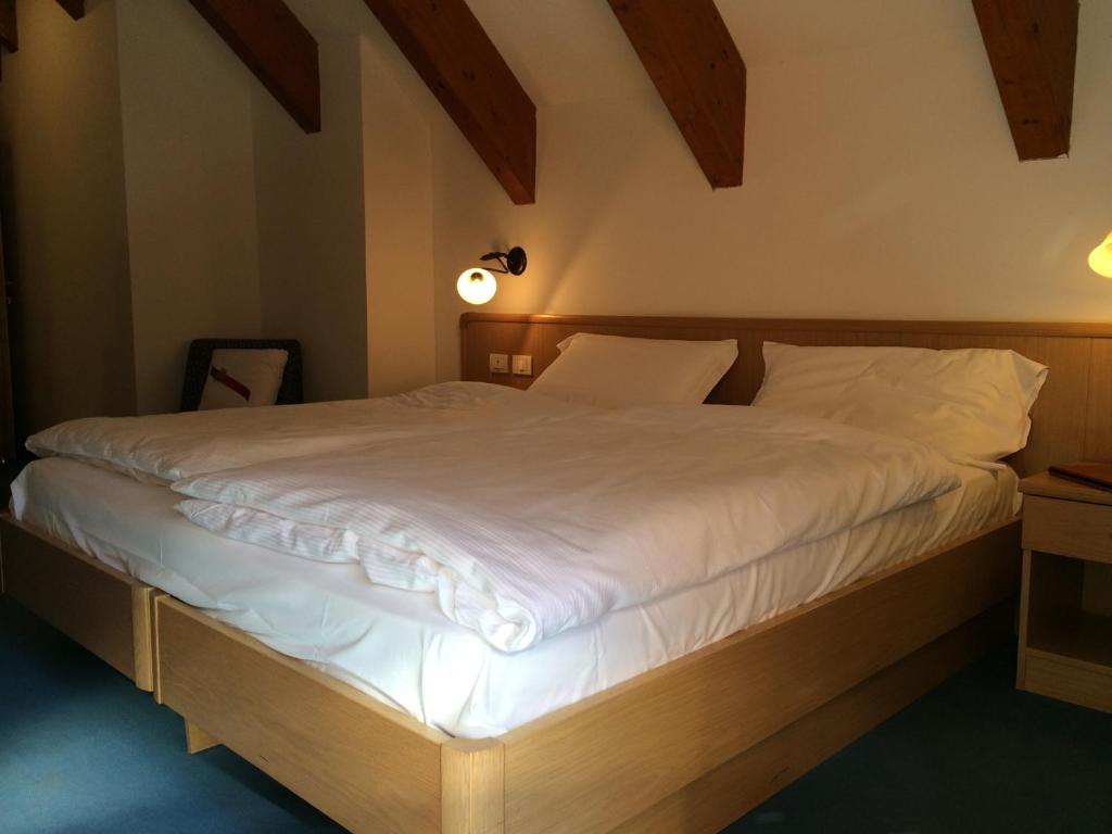 Postel nebo postele na pokoji v ubytování Hotel Fortini