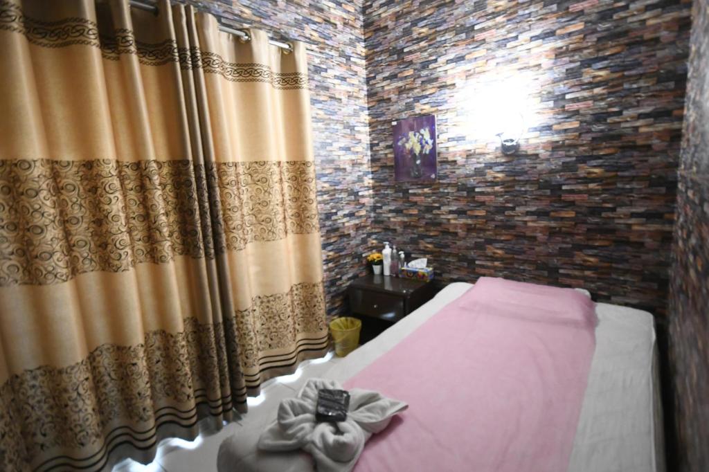 Postel nebo postele na pokoji v ubytování Aygro Hotel