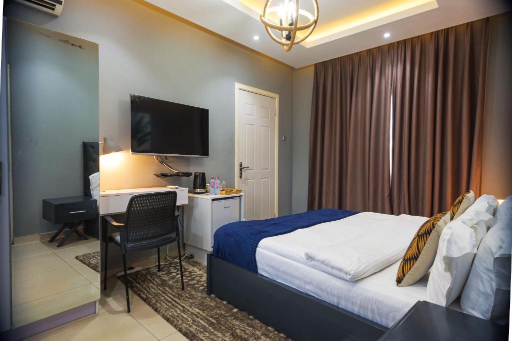 The Avery Suites, East Legon客房内的一张或多张床位