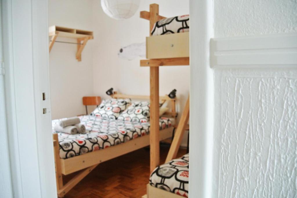 Postel nebo postele na pokoji v ubytování Nazaré Hostel - Rooms & Dorms