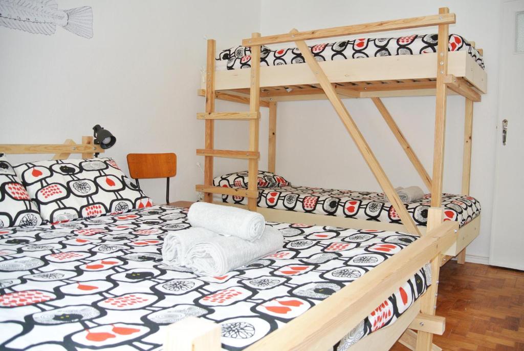 Postel nebo postele na pokoji v ubytování Nazaré Hostel - Rooms & Dorms