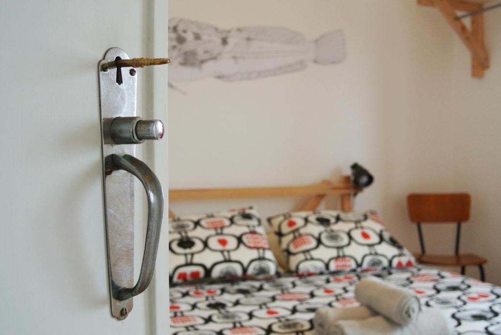 Postel nebo postele na pokoji v ubytování Nazaré Hostel - Rooms & Dorms