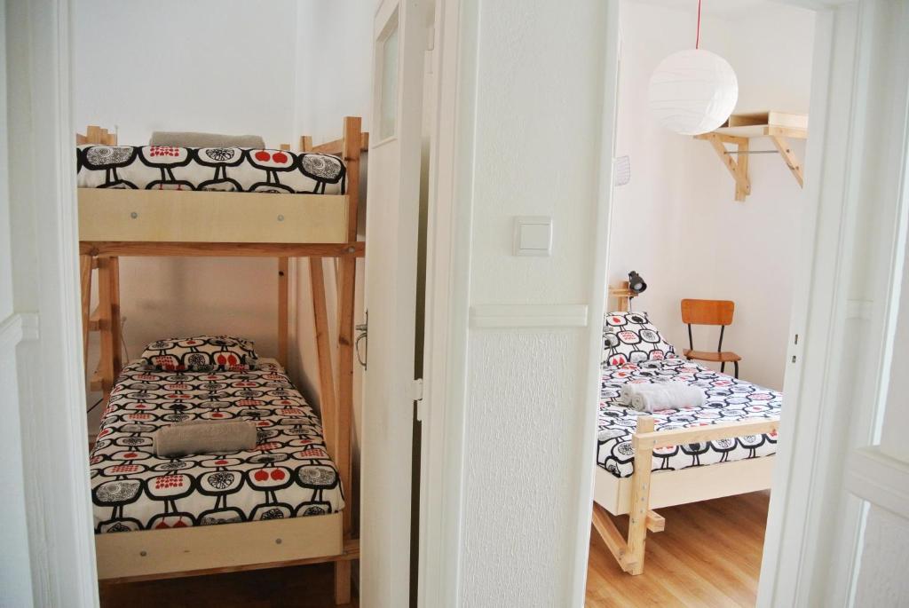 Postel nebo postele na pokoji v ubytování Nazaré Hostel - Rooms & Dorms
