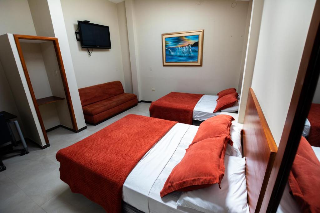 Postel nebo postele na pokoji v ubytování HM International Hotel