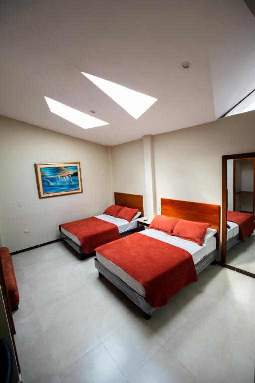 Postel nebo postele na pokoji v ubytování HM International Hotel