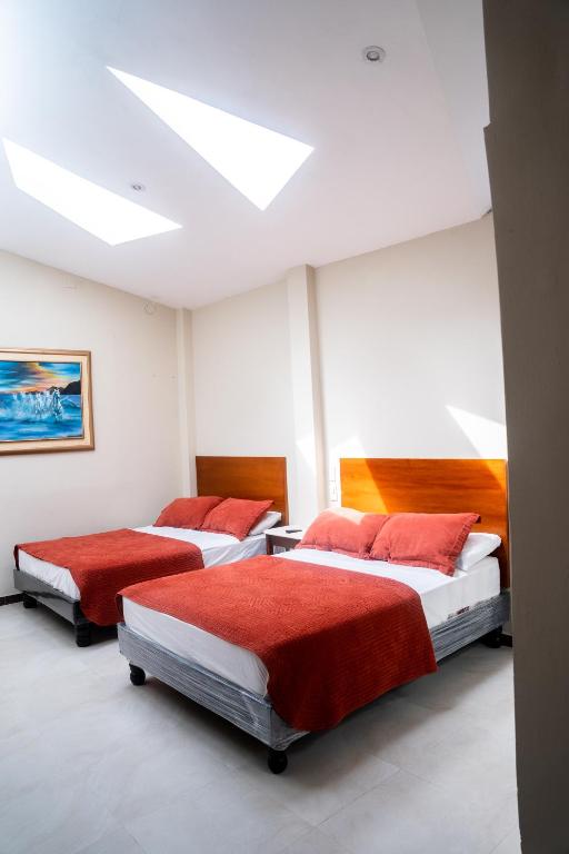 Postel nebo postele na pokoji v ubytování HM International Hotel