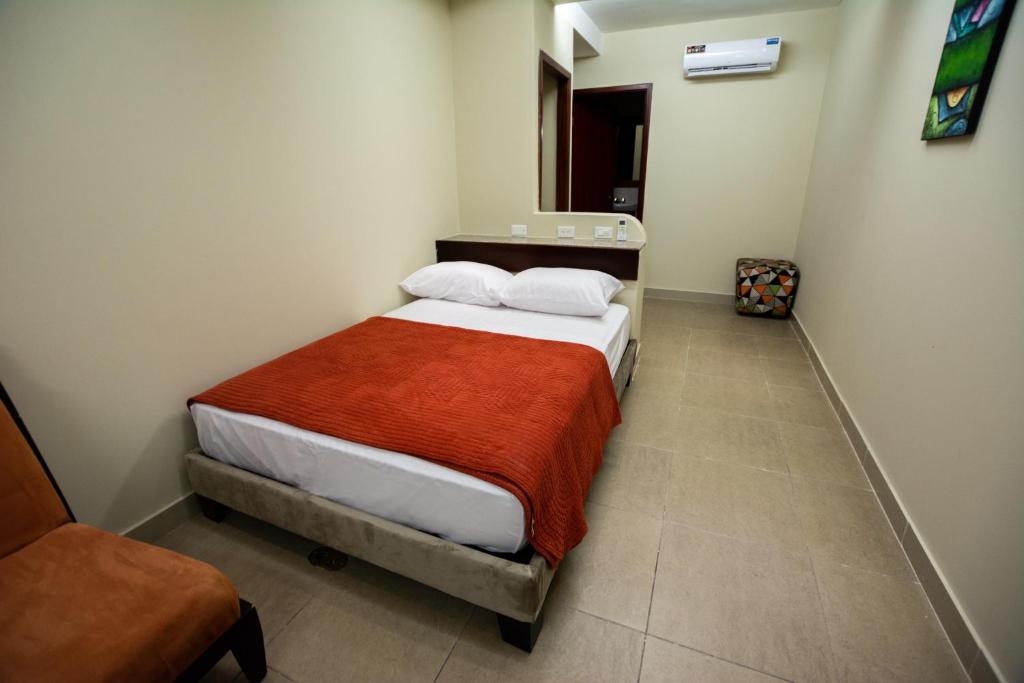 Postel nebo postele na pokoji v ubytování HM International Hotel