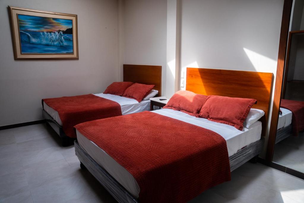 Postel nebo postele na pokoji v ubytování HM International Hotel