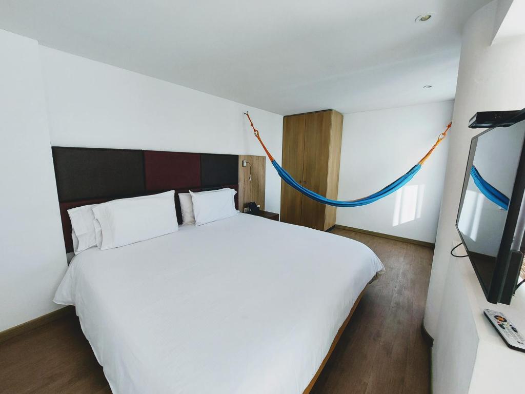 Postel nebo postele na pokoji v ubytování Hotel Viaggio Teleport City Suites