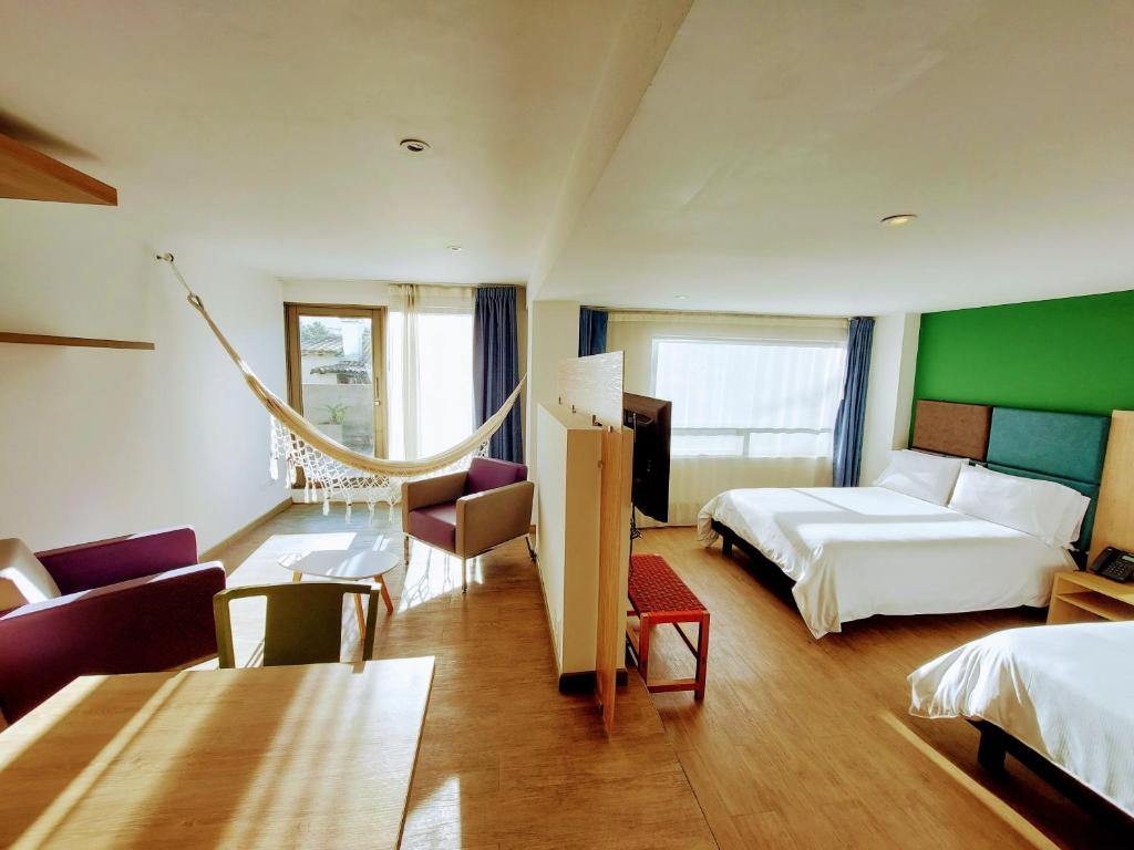 Postel nebo postele na pokoji v ubytování Hotel Viaggio Teleport City Suites