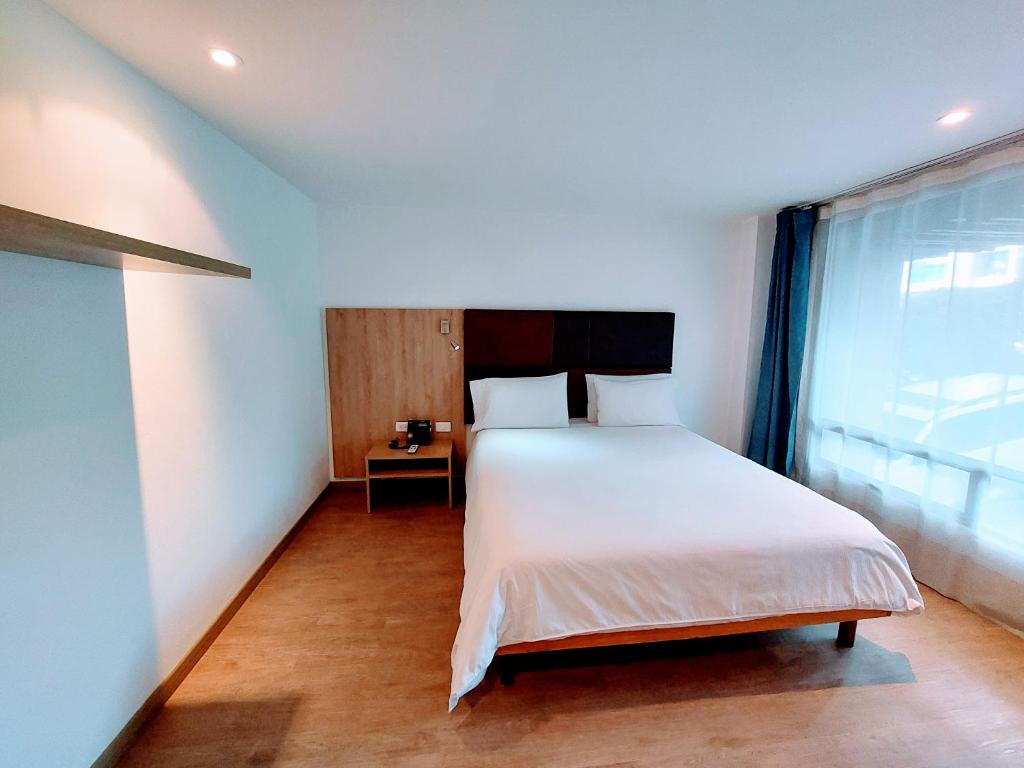 Postel nebo postele na pokoji v ubytování Hotel Viaggio Teleport City Suites