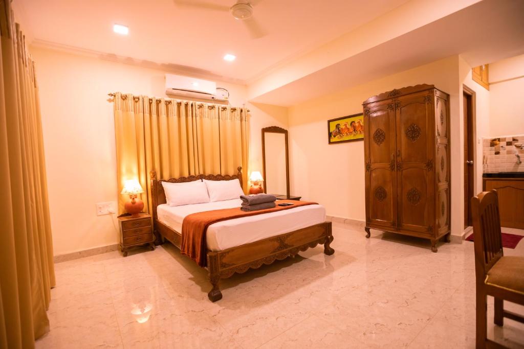 Postel nebo postele na pokoji v ubytování Primavera Holiday Homes-FAMILY RUN GOAN GUEST HOUSE