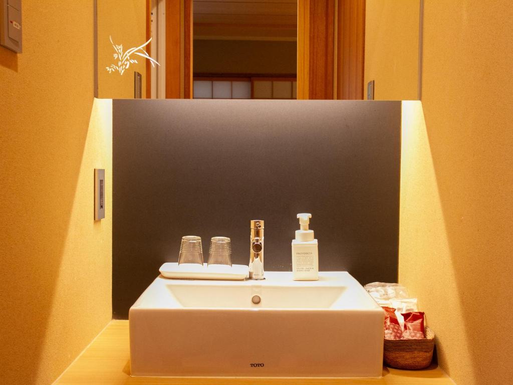 Koupelna v ubytování Hotel Rakurakuan