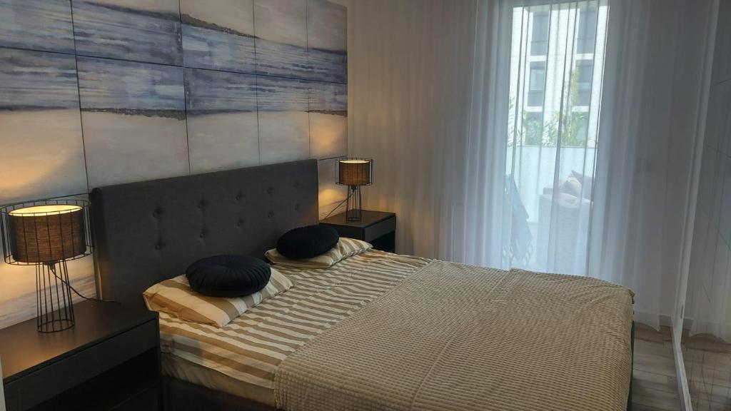 Posteľ alebo postele v izbe v ubytovaní Apartament Mare , Rewal ulica Szczecińska 21 Apartament nr 3