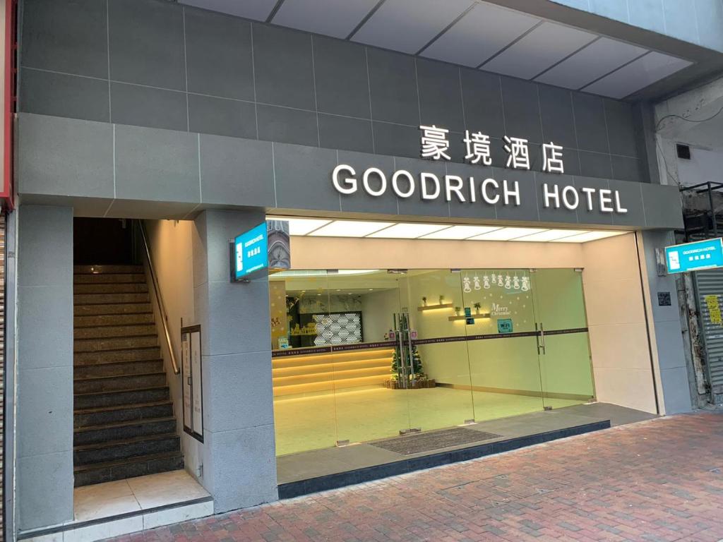 a store front of a hotel with a sign on it at Goodrich Hotel in Hong Kong