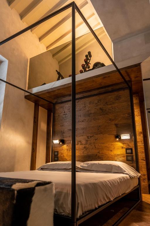 Łóżko lub łóżka w pokoju w obiekcie Oltrarno 1881 Apartments