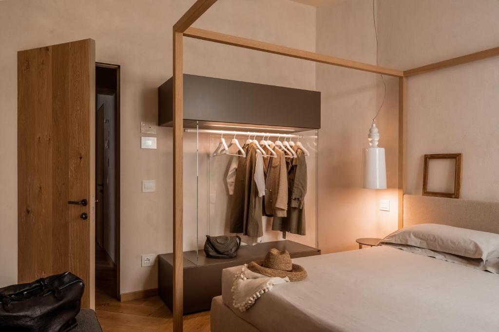 Łóżko lub łóżka w pokoju w obiekcie Oltrarno 1881 Apartments